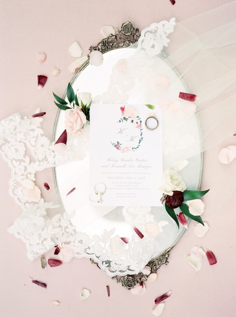 flat lay image of wedding invitation and wedding details