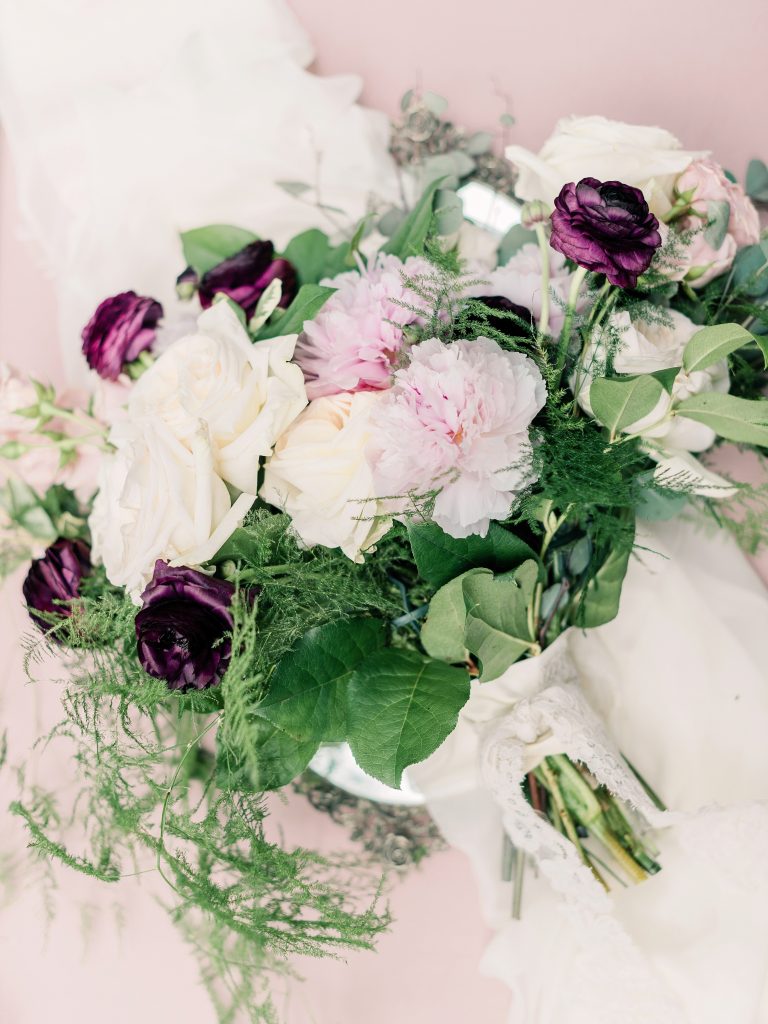 bridal bouquet with cream, blush and mauve flowers and greenery