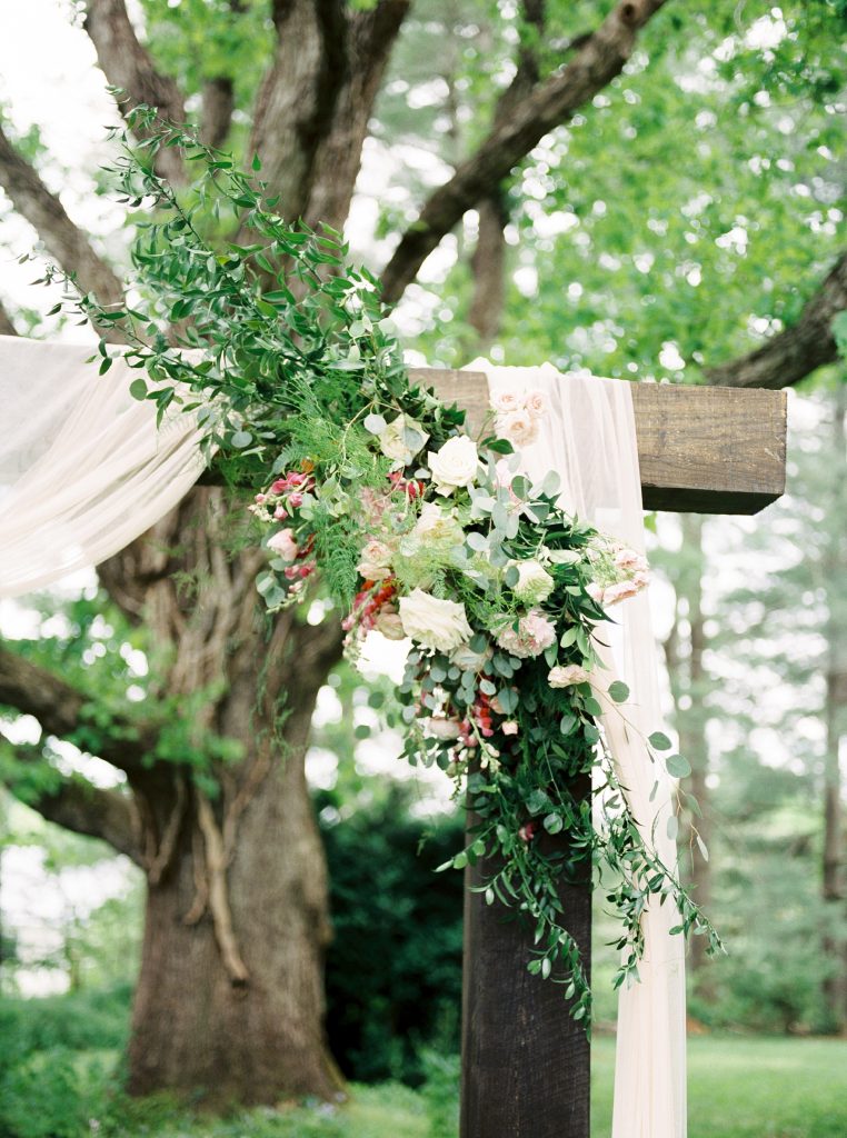 floral design on the arbor at a wedding in Charlottesville VA
