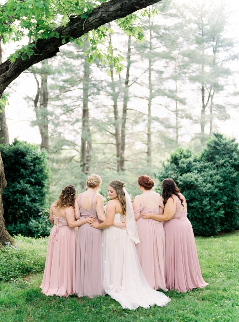 bride and her bridesmaids at her Greencloft Club wedding in charlottesville VA