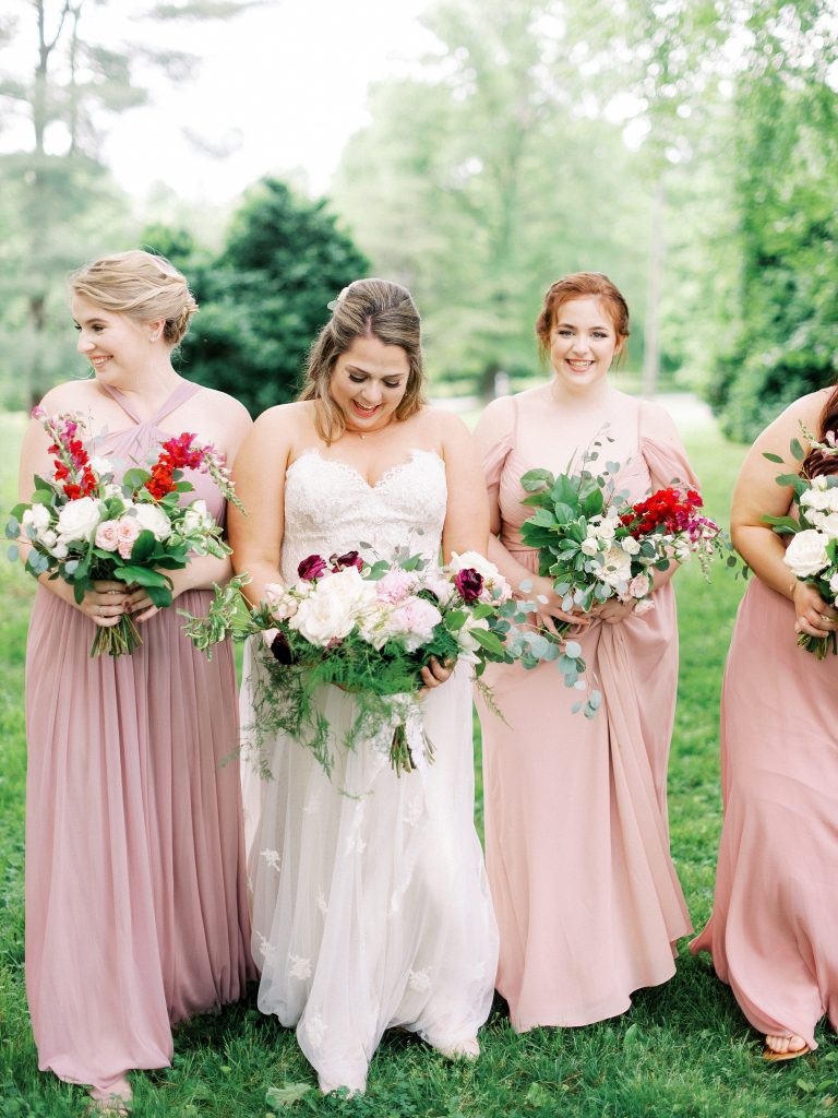 bride and her bridesmaids at her wedding in charlottesville VA