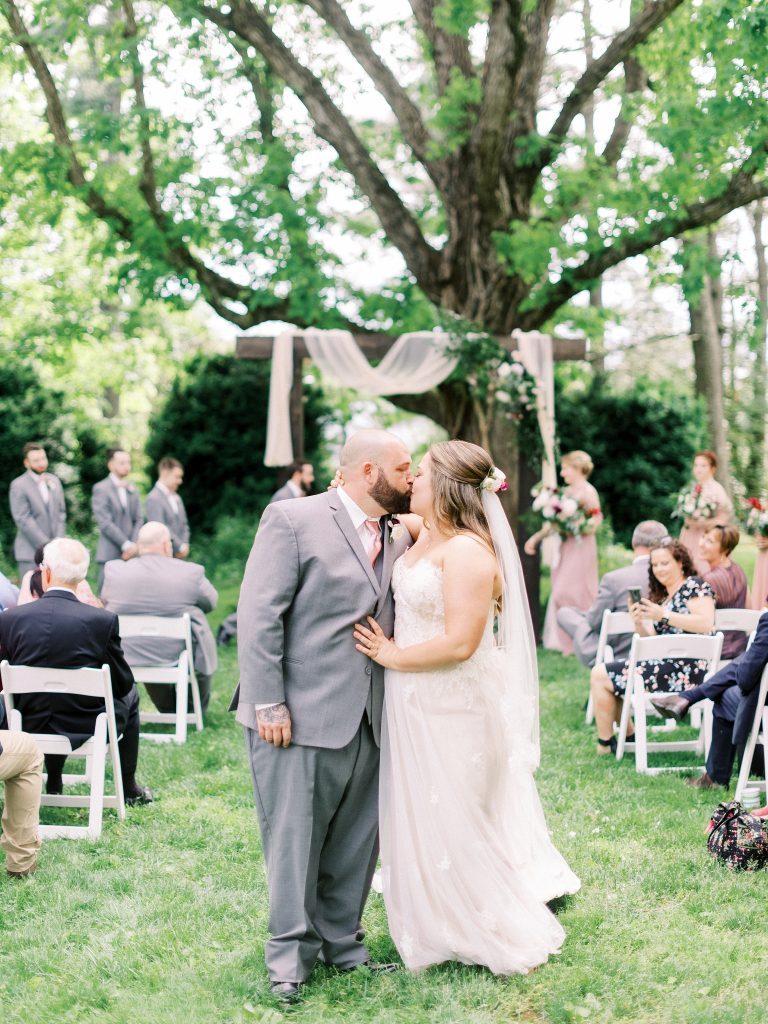 bride and groom recessional after their ceremony at the greencloft club in charlottesville va
