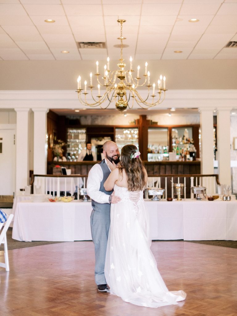 bride and groom's first dance at the reception at the greencloft club in charlottesville va